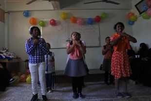 Faculty of Girls shares orphans their joy in the Arab Orphan Day